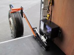 During operation the platform can be lowered onto the ground to create a stable area for working.